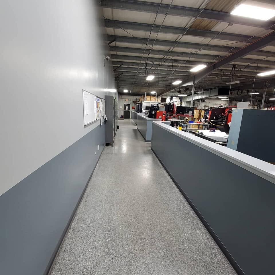 Industrial walkway finished with a durable flake epoxy floor