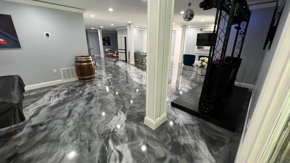 Entertainment space with a silver metallic marble epoxy floor