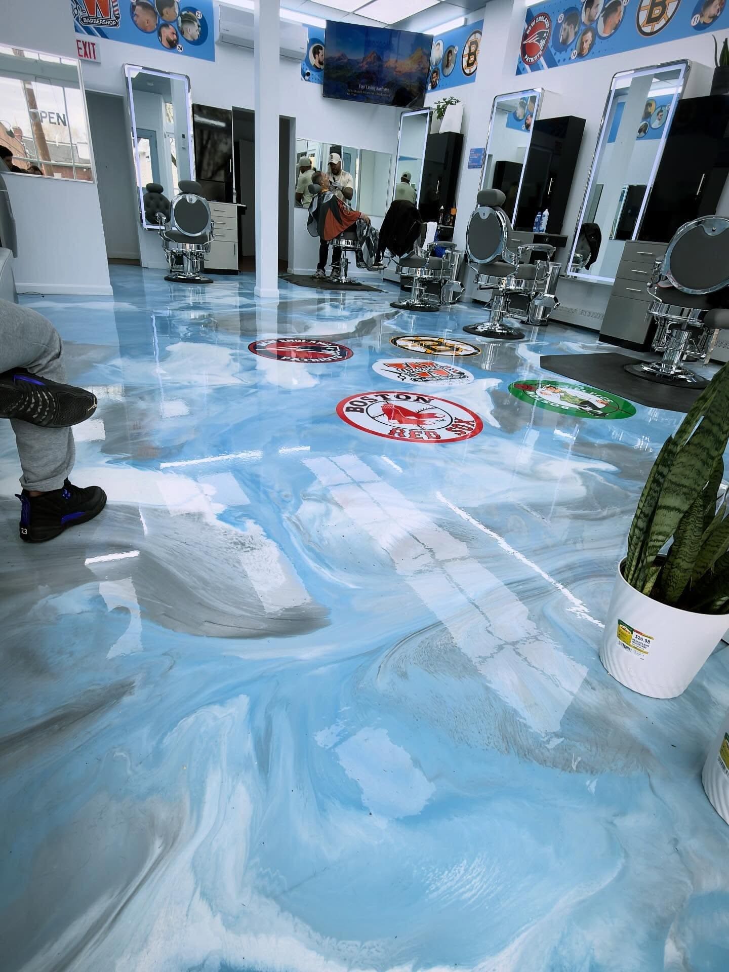 Barbershop chairs on a light blue metallic epoxy floor