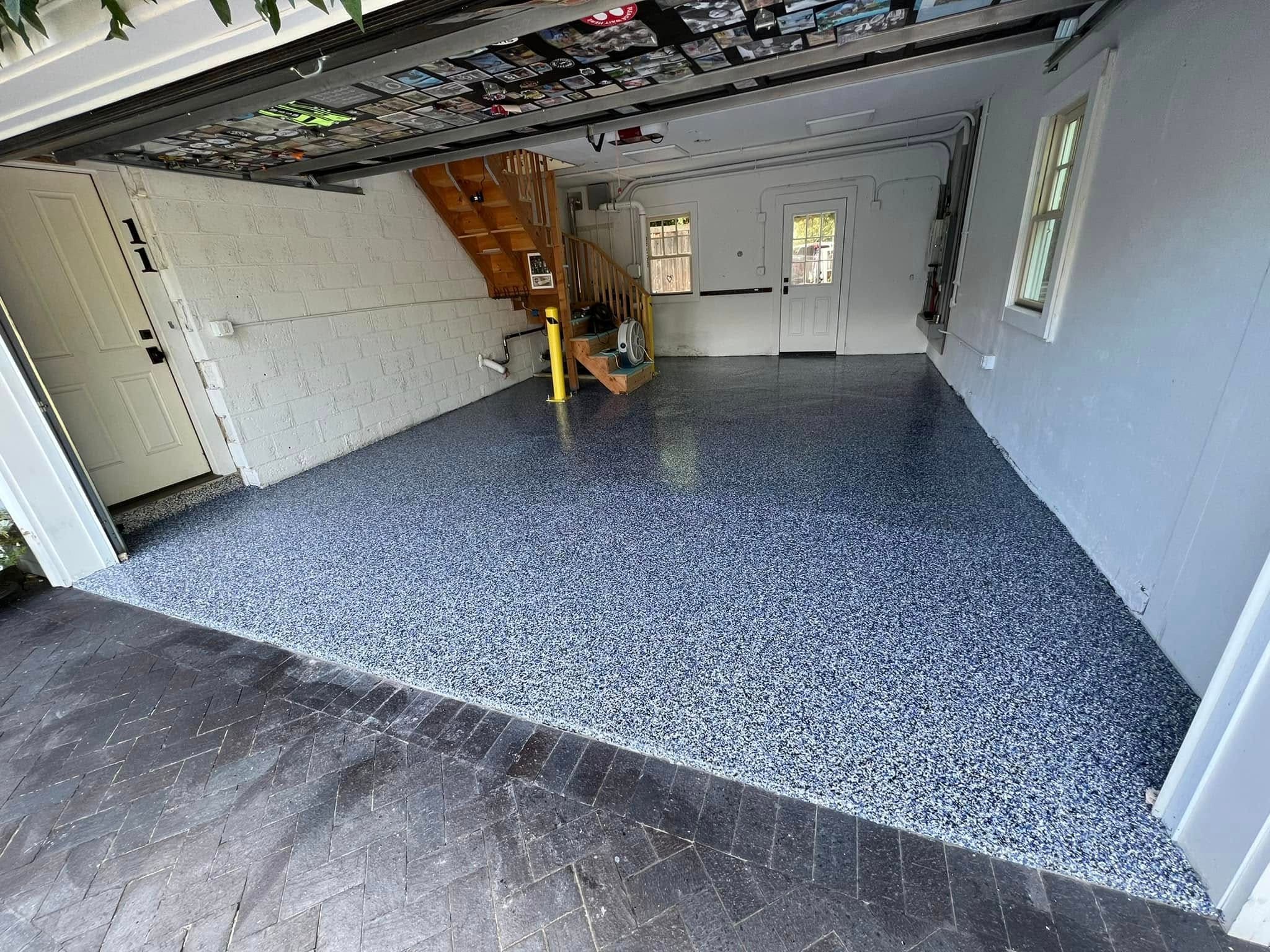 Garage finished with a blue and white flake epoxy floor