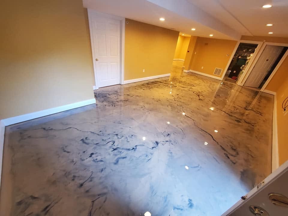 Basement room with a blue-veined metallic epoxy floor